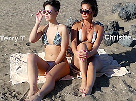 Two Young Hotties Down At The Beach In Bikinis In The Sun Having Fun